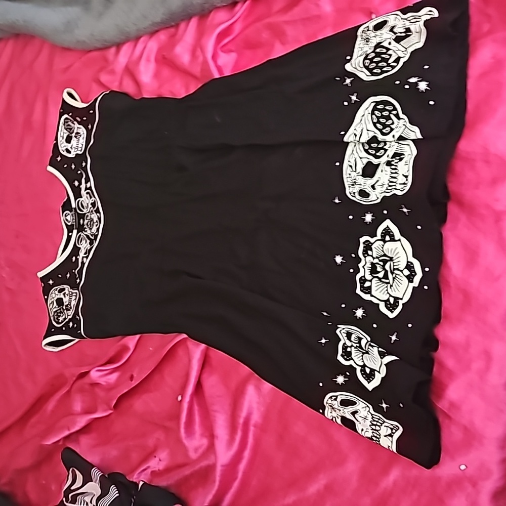 Black & white dress with skulls and flowers.